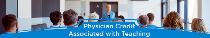 Female physician at front of room teaching medical residents and students